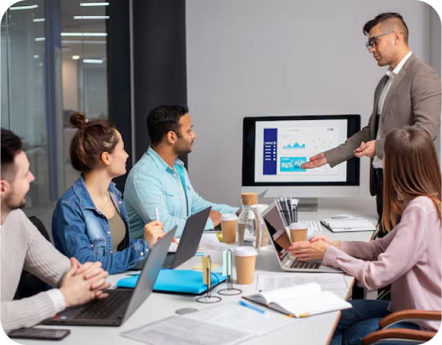 Team of people in a meeting discussing SEO strategies