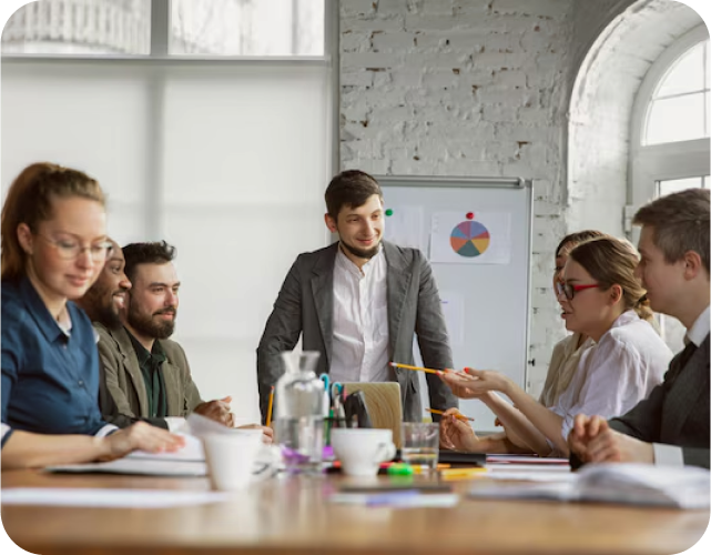 Team of people in a meeting discussing SEO strategies